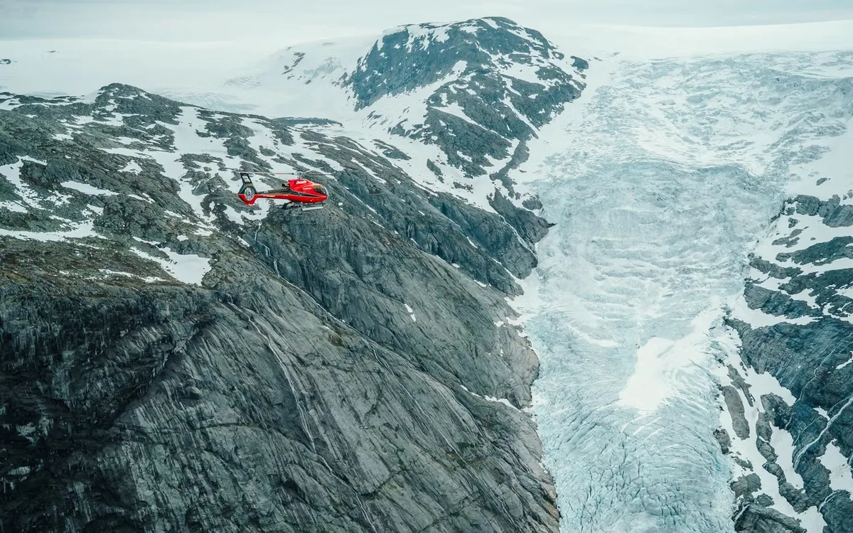 Helicopter beside a glacier