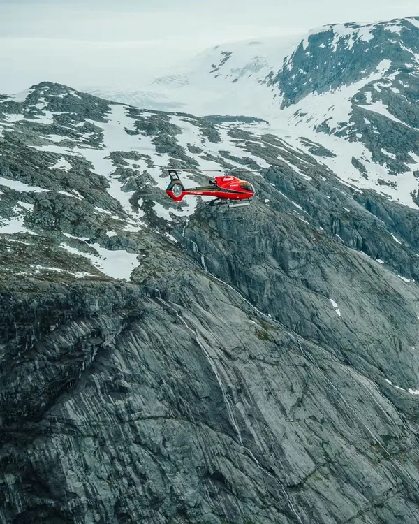 Helicopter beside a glacier